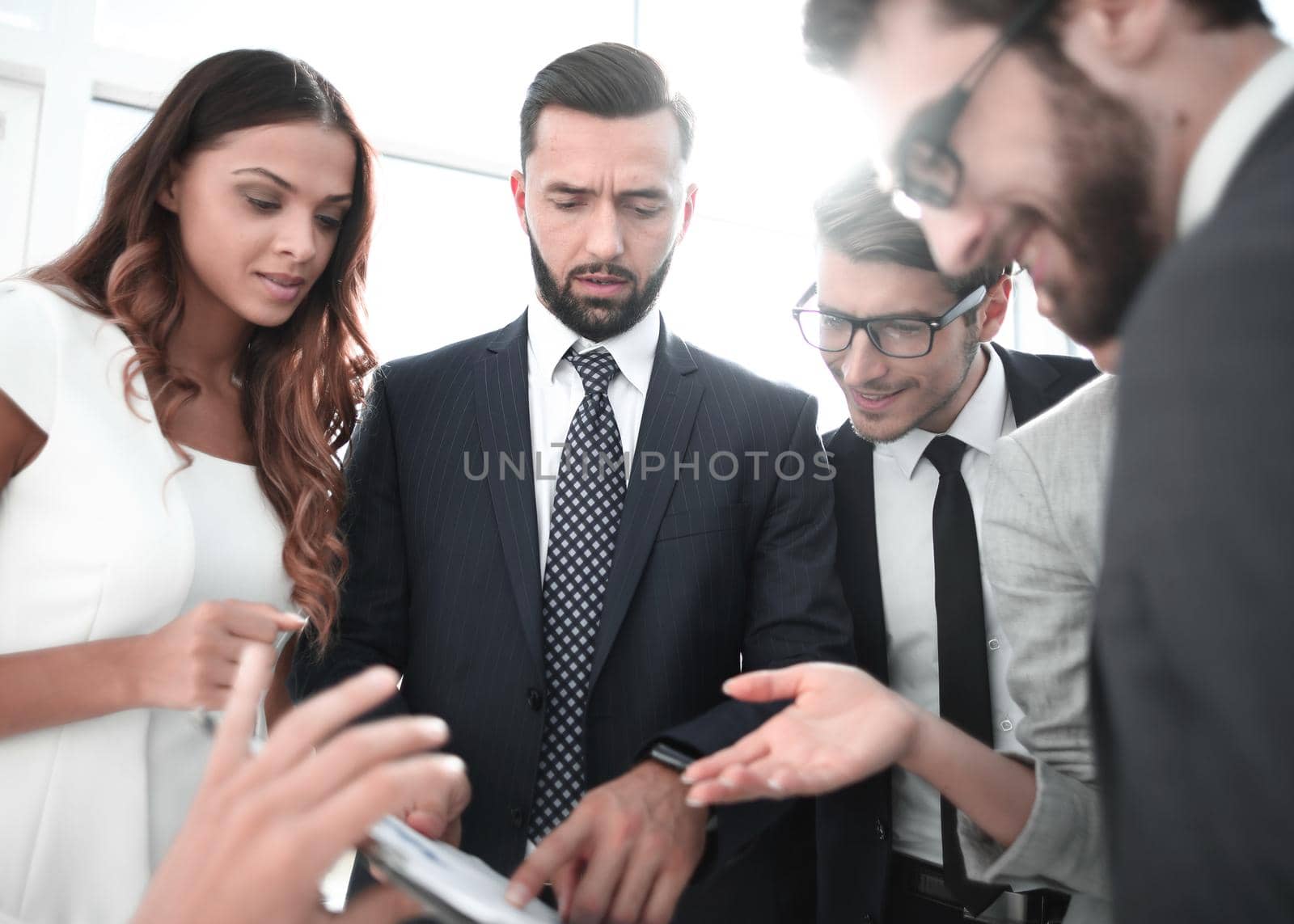 close up.business team discussing the terms of the contract by asdf