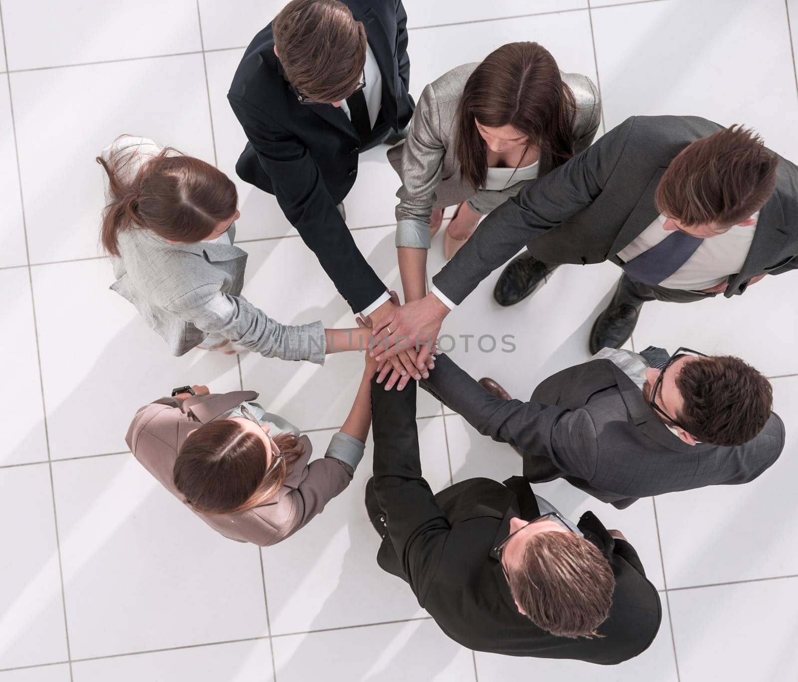 top view.a group of employees standing in a circle by asdf