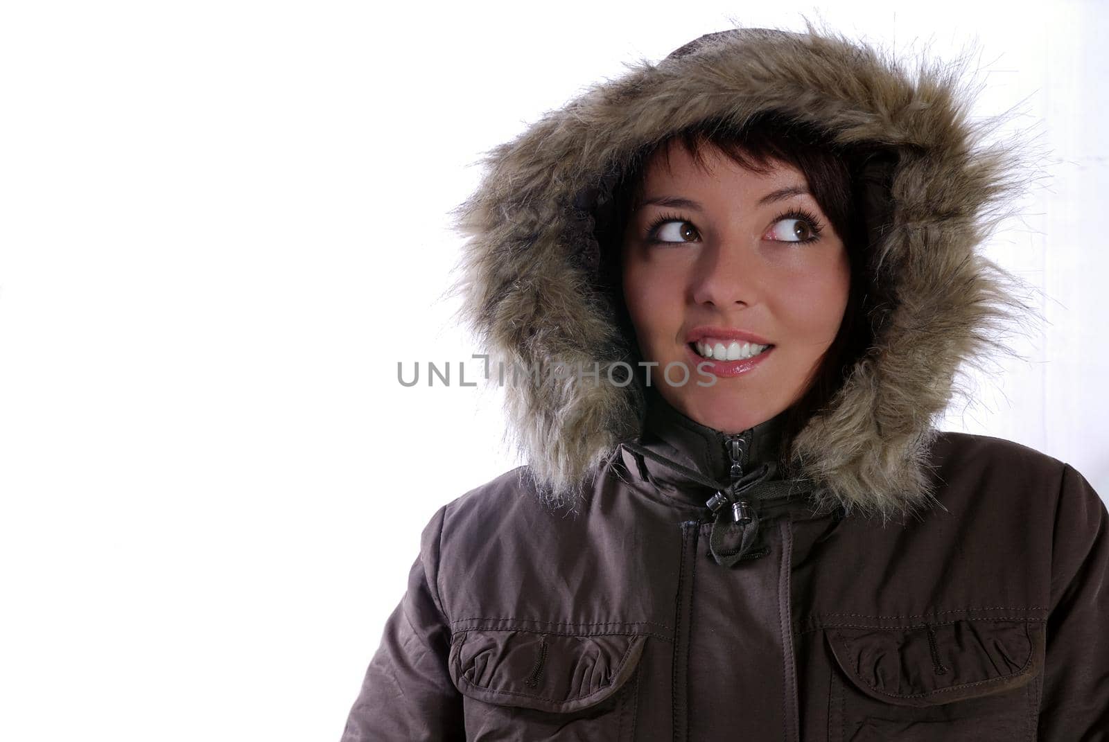 Cute young woman smiling in winter jacket