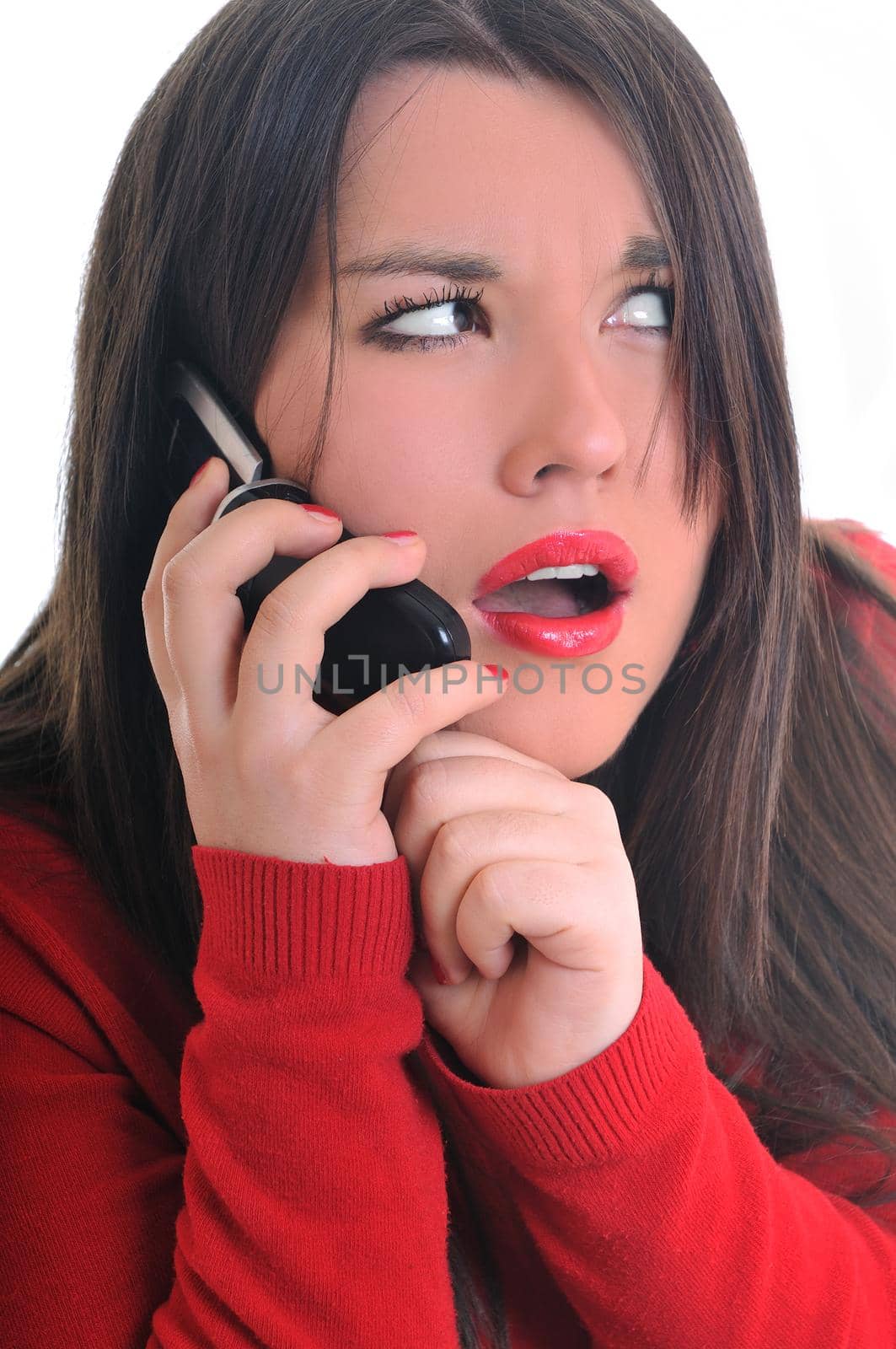 young business woman in red isolated on white talking on cell phone