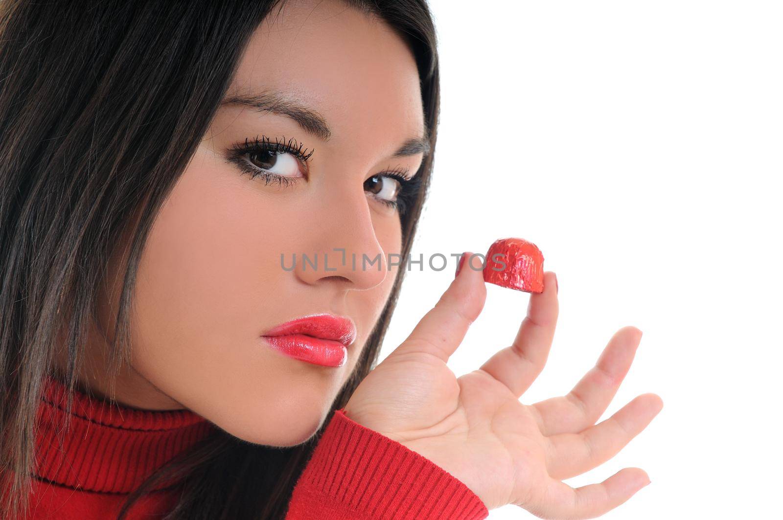 young woman isolated on white in red shirt eat sweet tasty chocolate