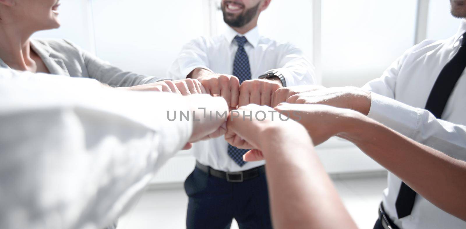 close up.a group of business people showing their unity.the concept of teamwork