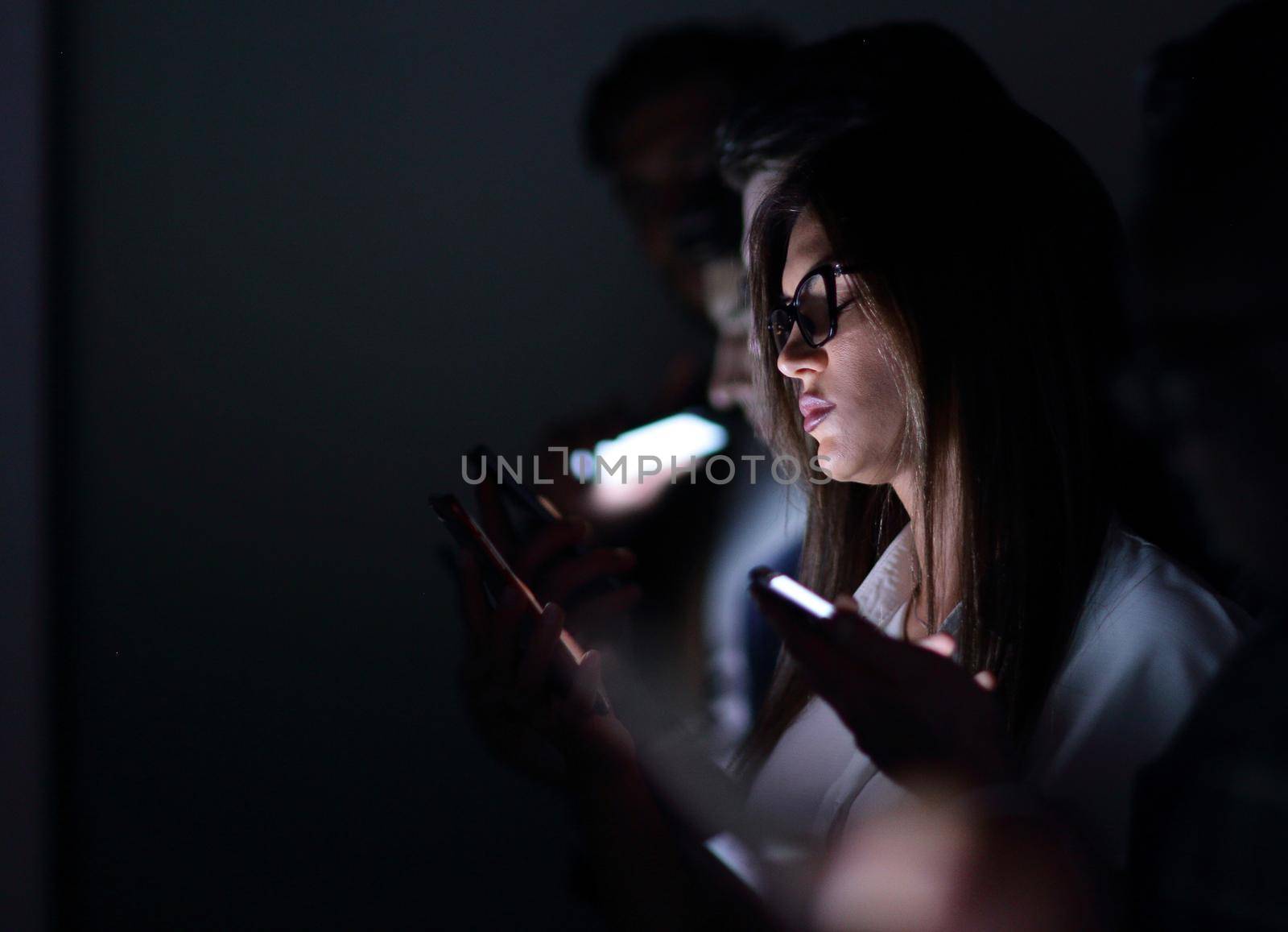 close up.image of colleagues with gadgets by asdf