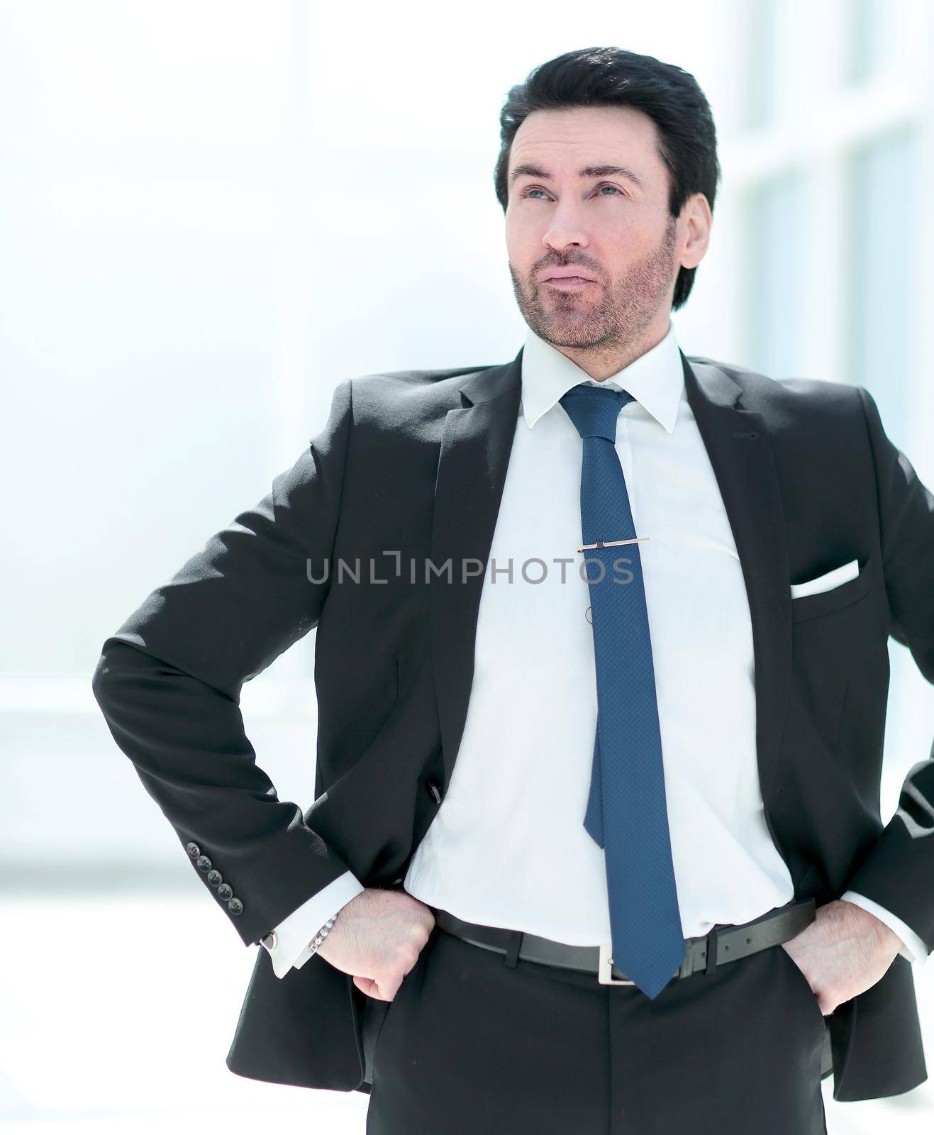 pensive businessman looking at copy space by asdf