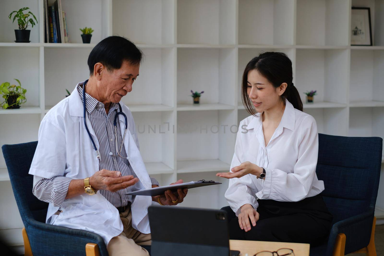 A woman seeks medical advice about her health and future plans. Doctor explain Healthcare and medical concept. by itchaznong