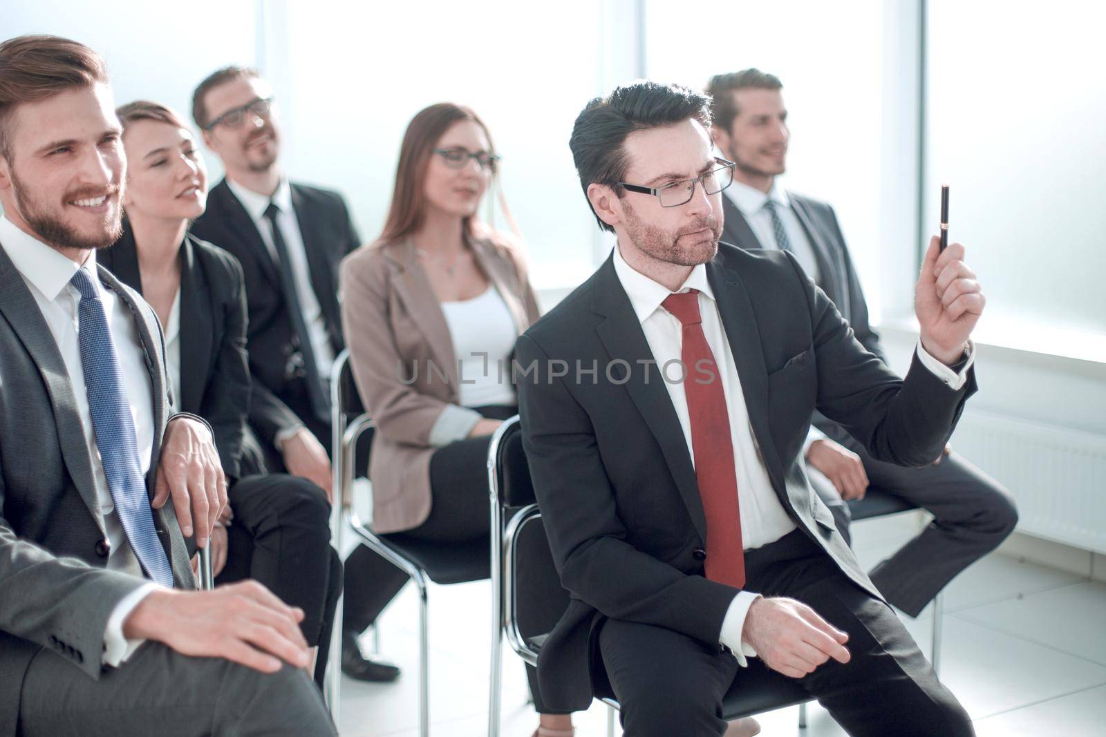 Manager asks a question at a business meeting.business concept