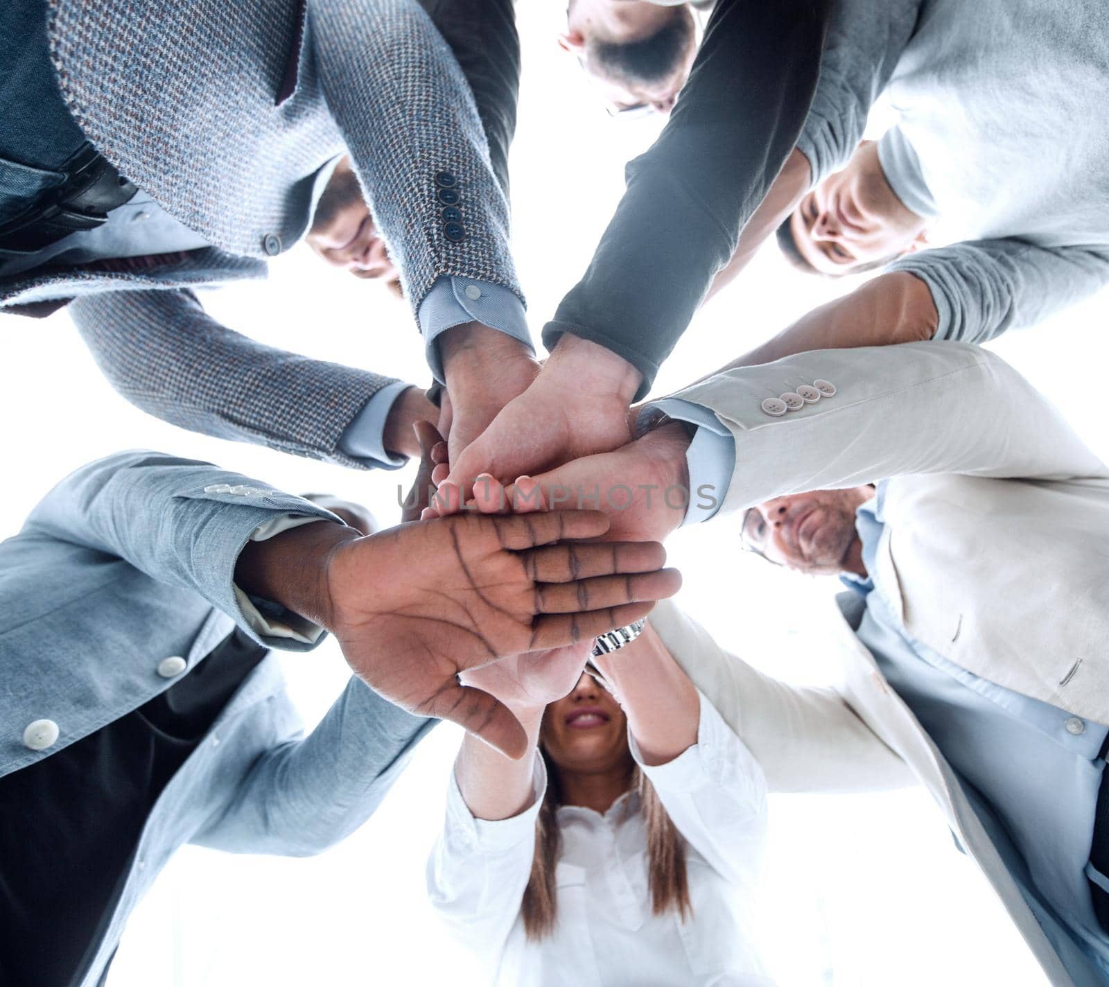 bottom view.business team folded their hands together.business background