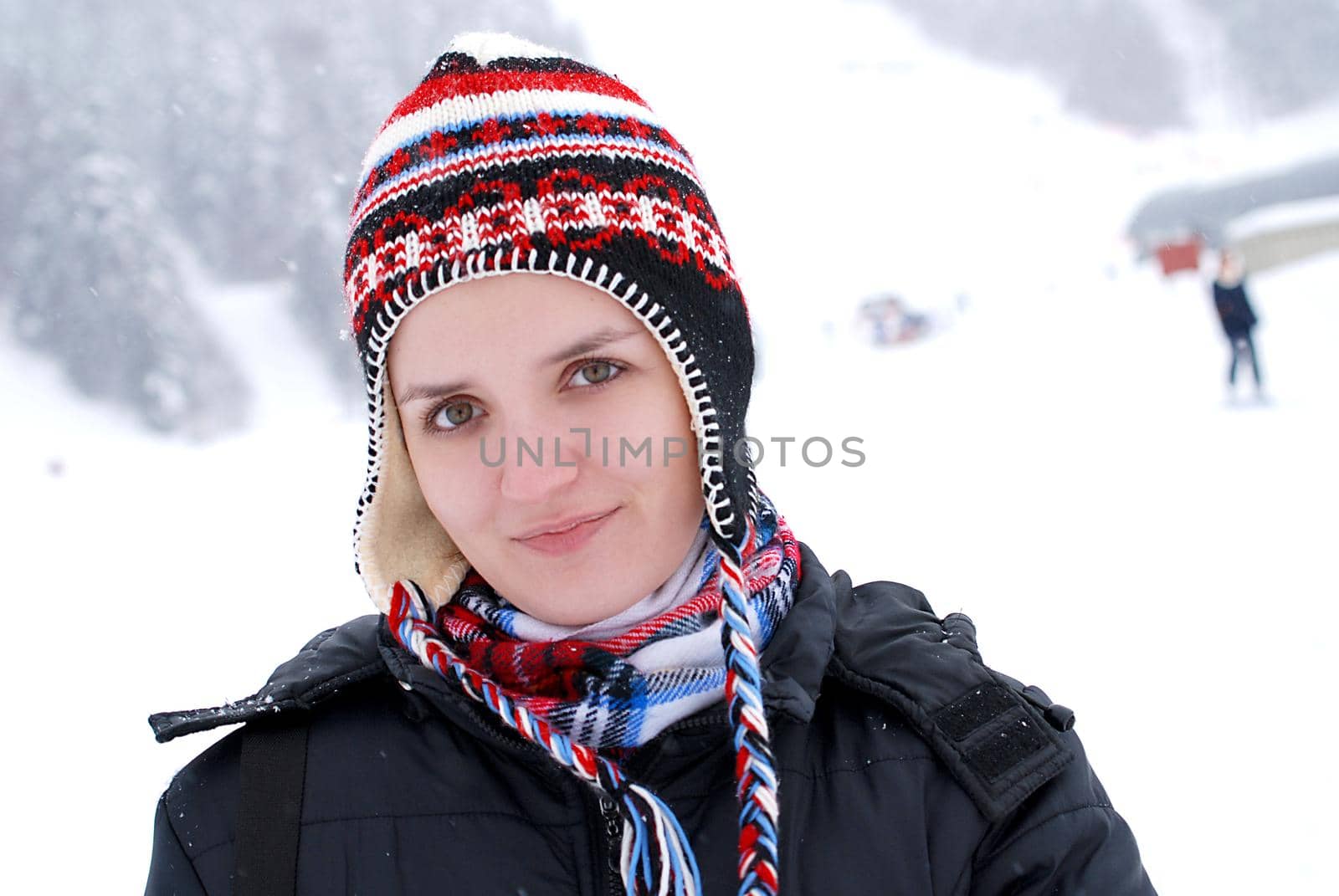 girl smiling and snow is falling