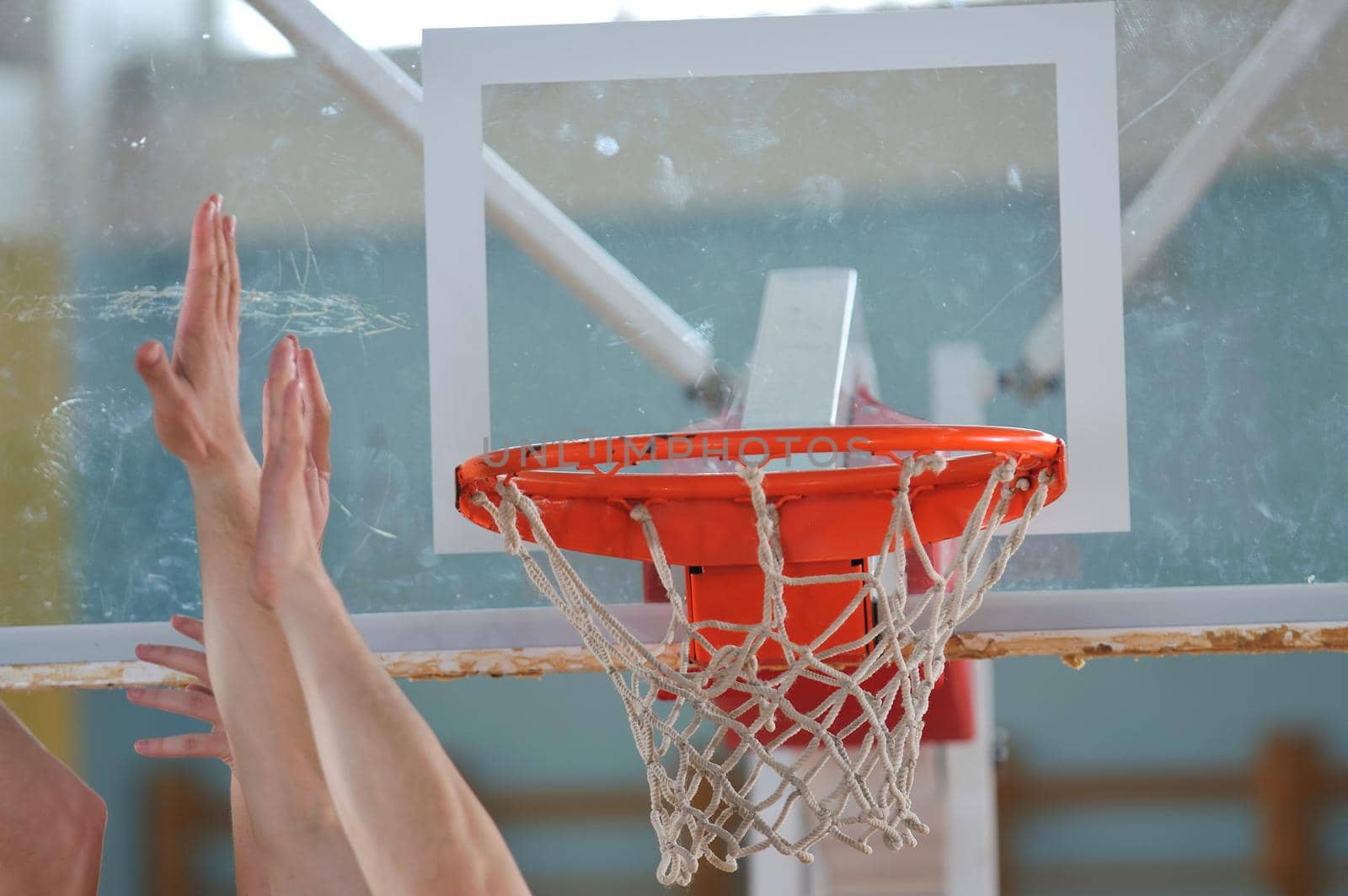 competition cencept with people who playing basketball in school gym 