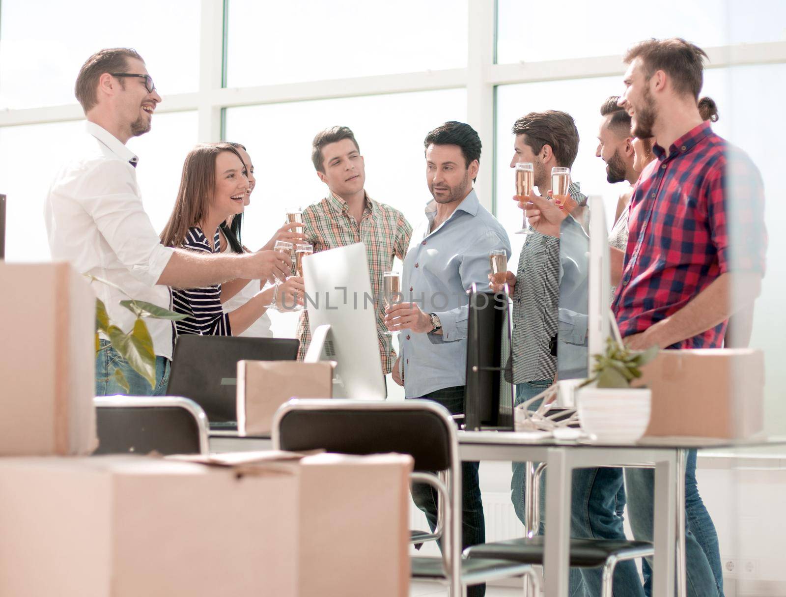 business team celebrates the move while standing in the office.the concept of a startup