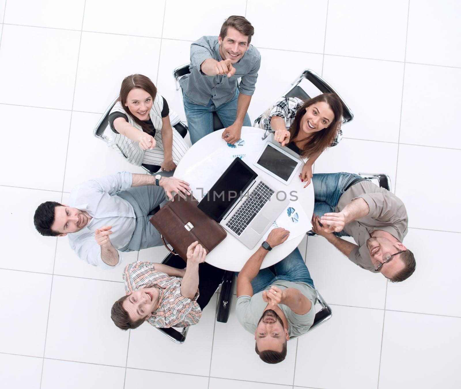 top view.a successful business team pointing to you .success concept