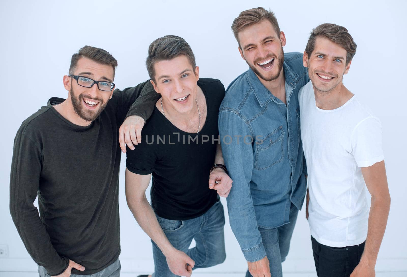 top view..a group of happy young men looking at the camera.isolated on white