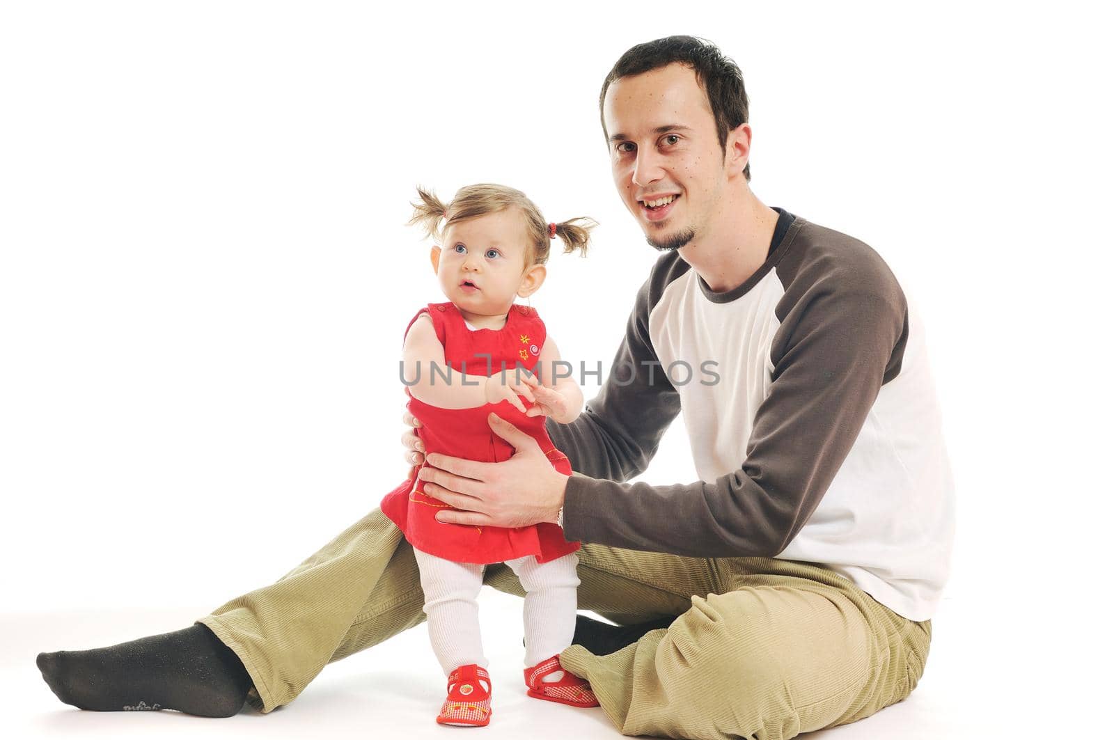 young male man parent play with beautiful little baby