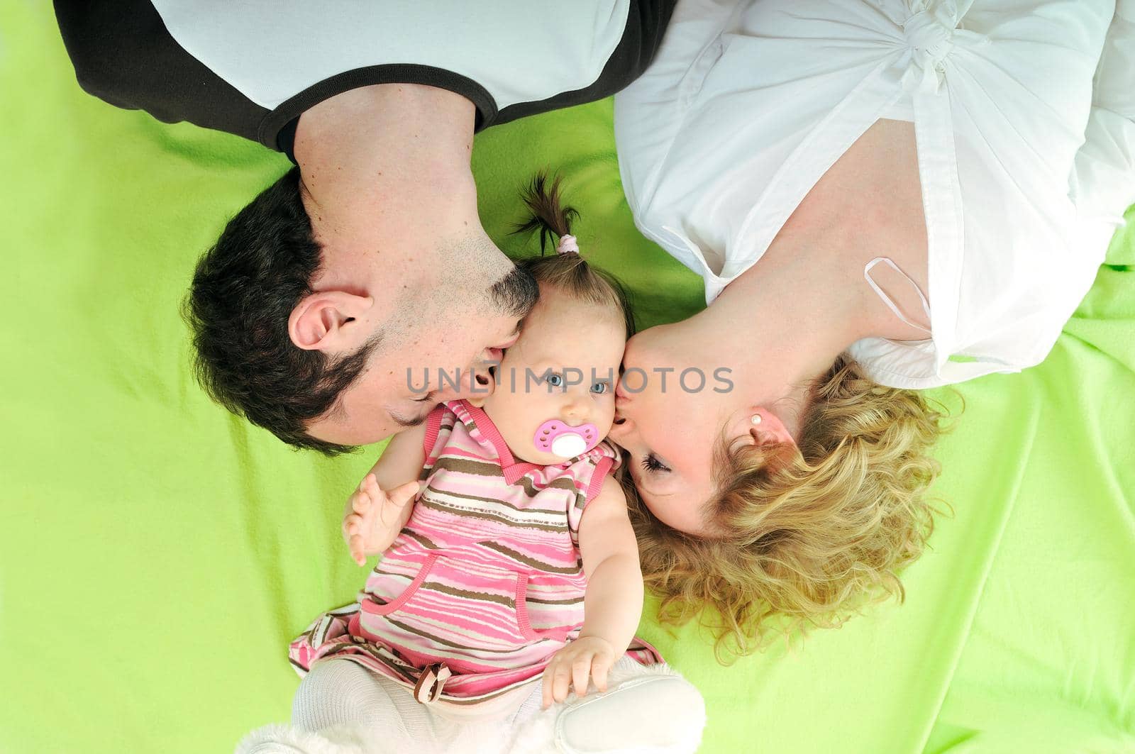 young happy family with beautiful baby playing and smile  isolated on white