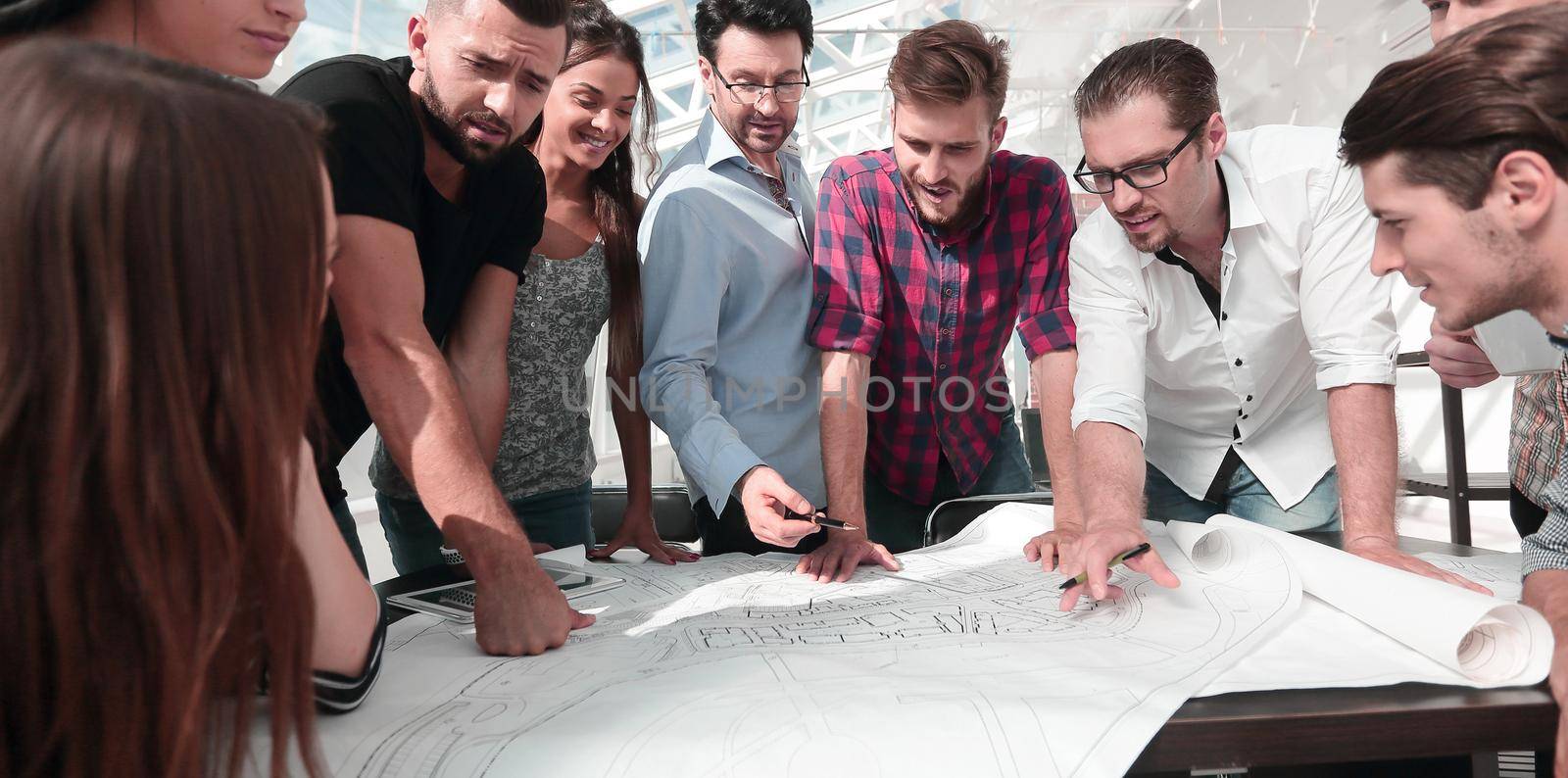 group of architects and business people working together . the concept of teamwork