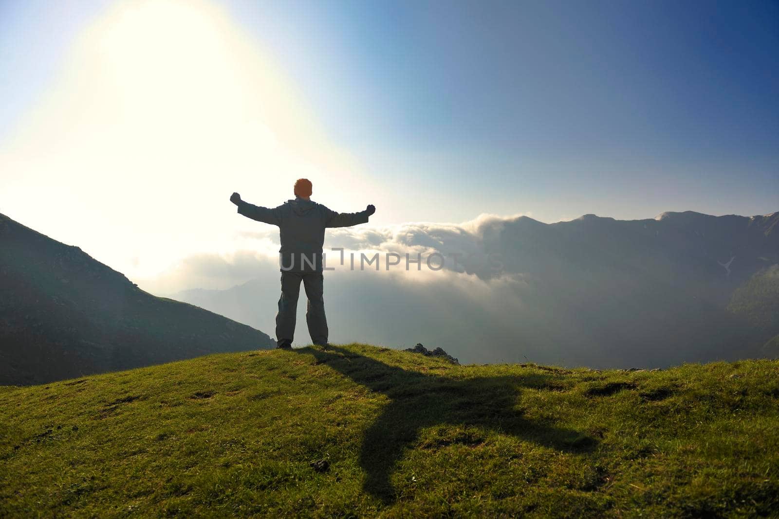 healthy young man practice yoga in height mountain at early morning and sunrise