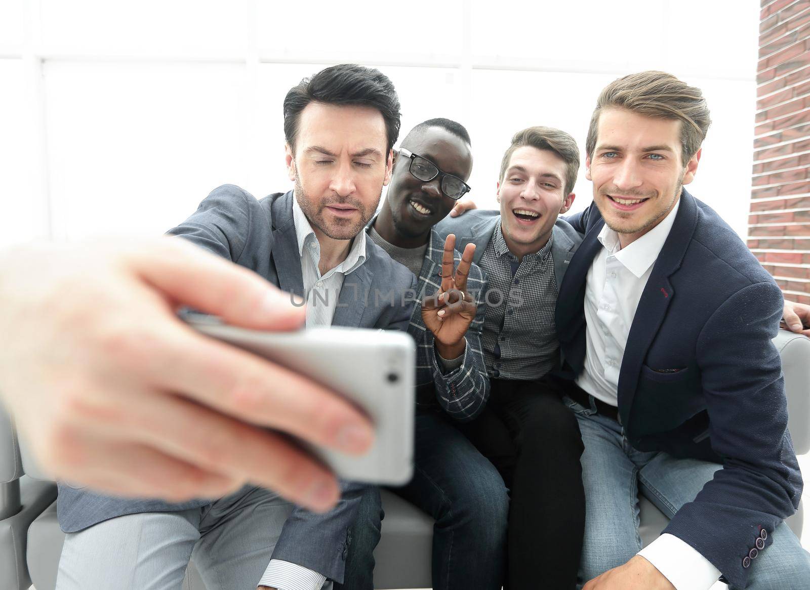 Manager and his business team take selfies by asdf
