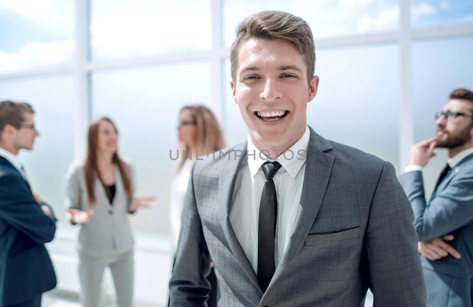 young businessman standing in the office lobby .business and education