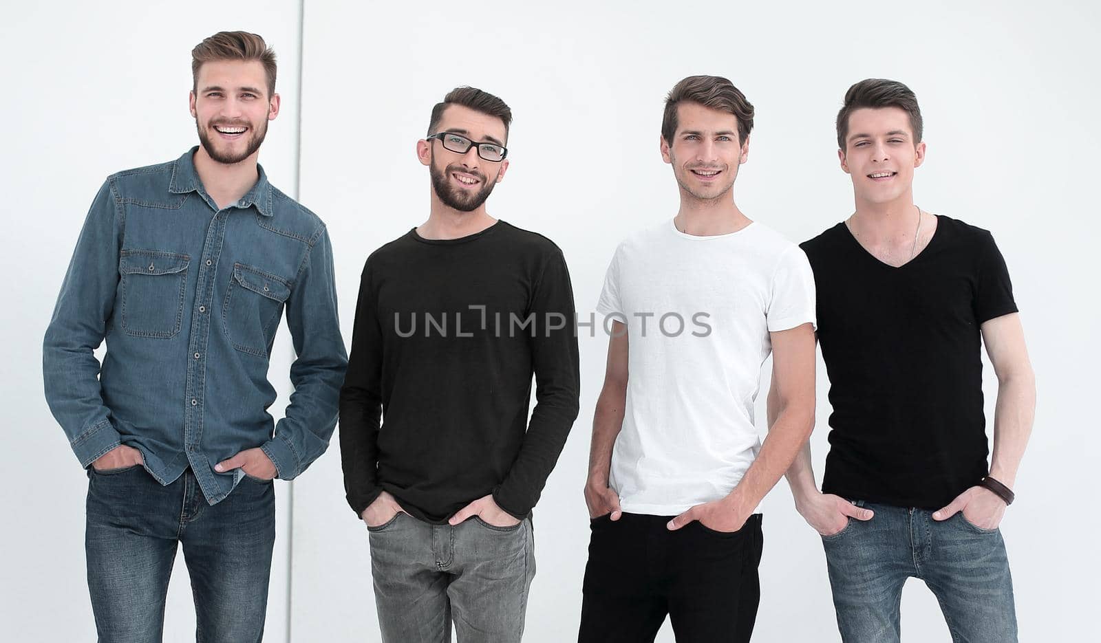 in full growth. a group of modern young men .isolated on white