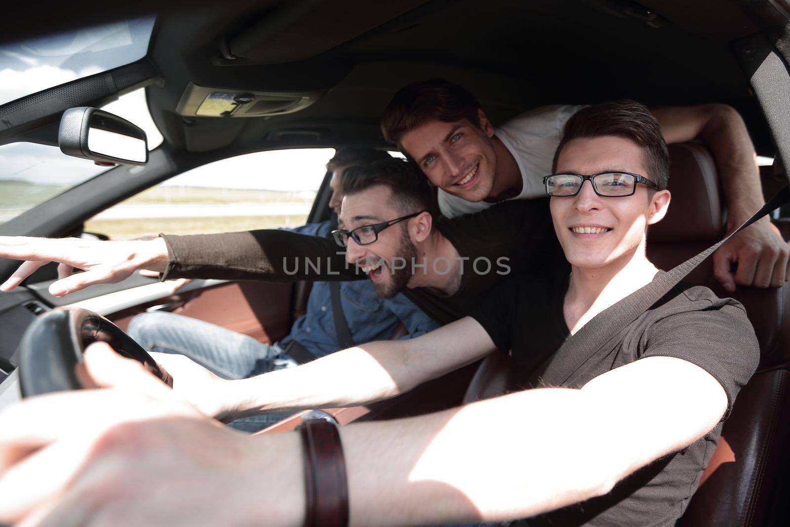 Group Of Friends In Car On Road Trip Together by asdf