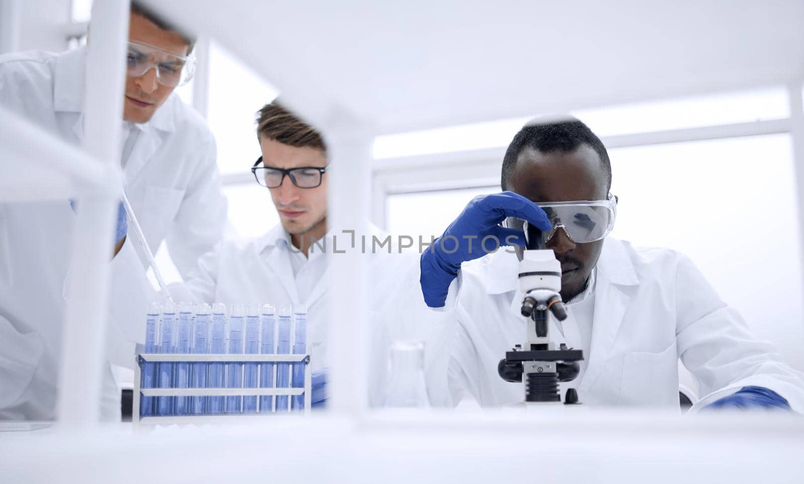 group of scientists working with liquids in the laboratory.photo with copy space