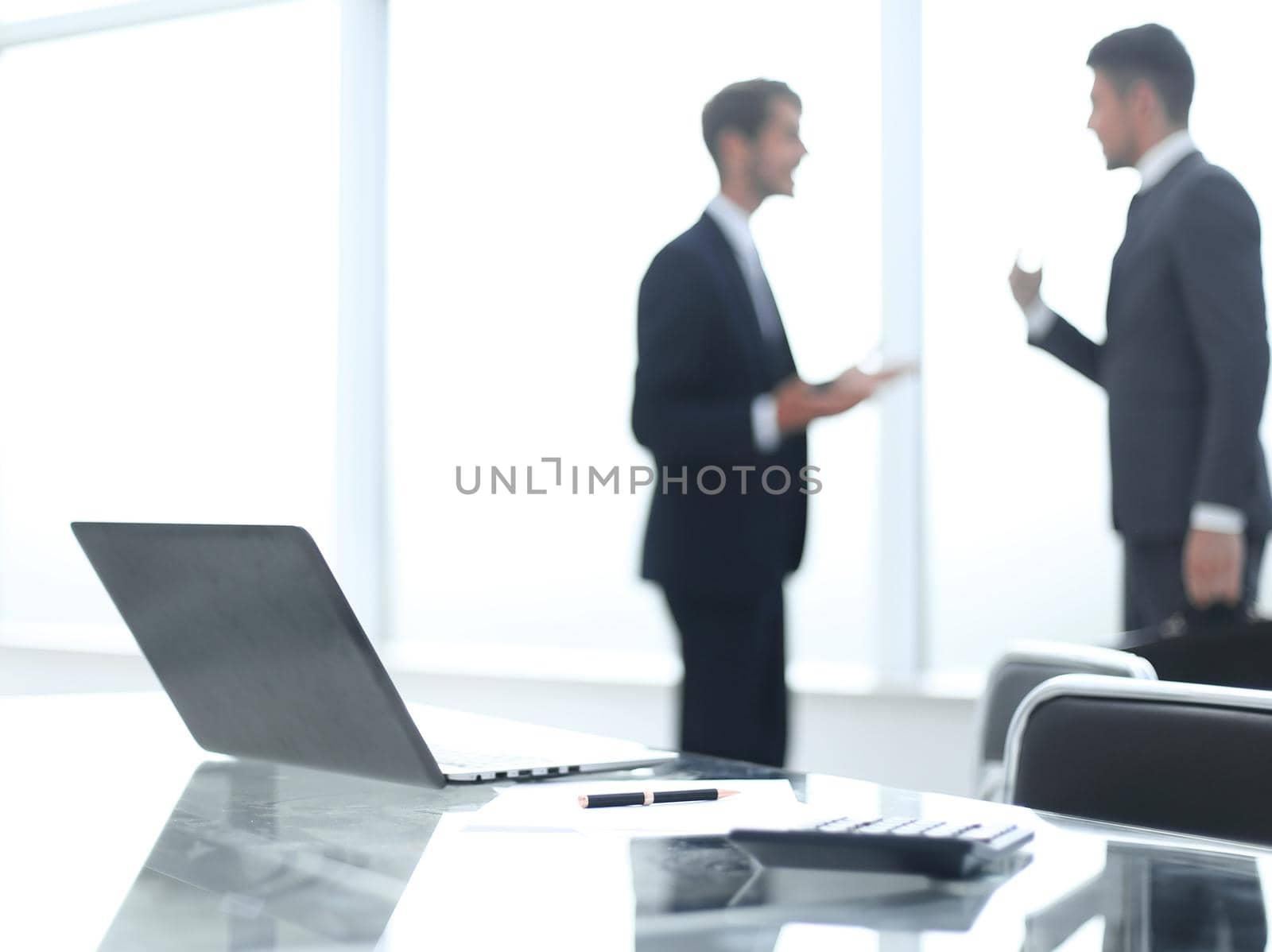 two young businessmen are introduced to each other by asdf