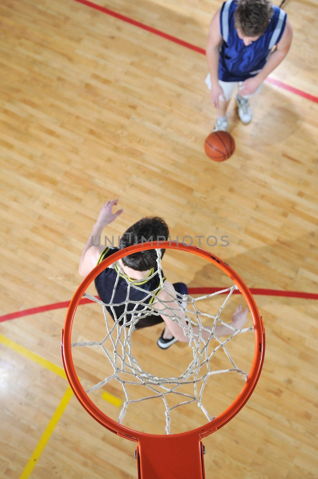 competition cencept with people who playing basketball in school gym