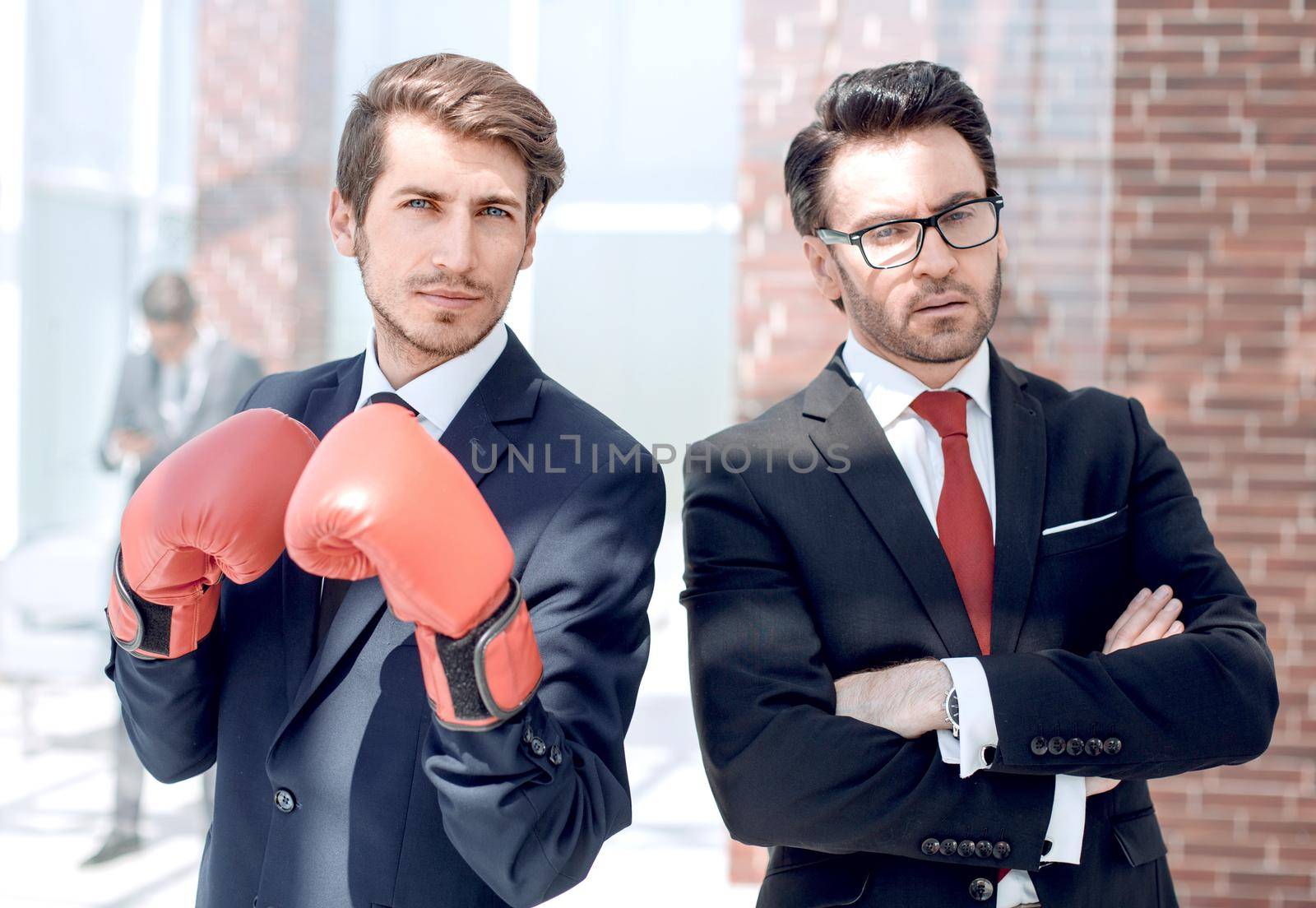 two confident businessman standing in the office by asdf