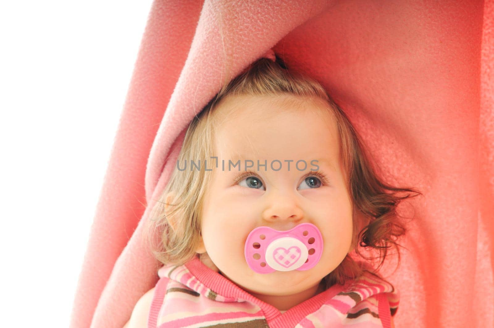 cute little baby isolated on white under blanket alone