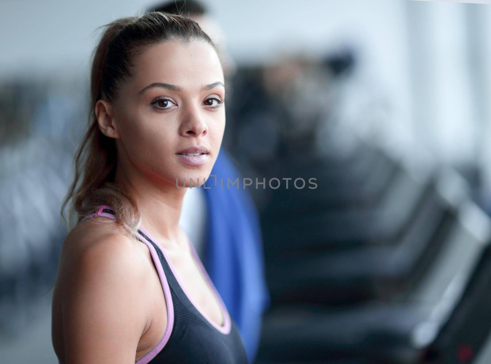 close up. attractive young woman in the gym. by asdf