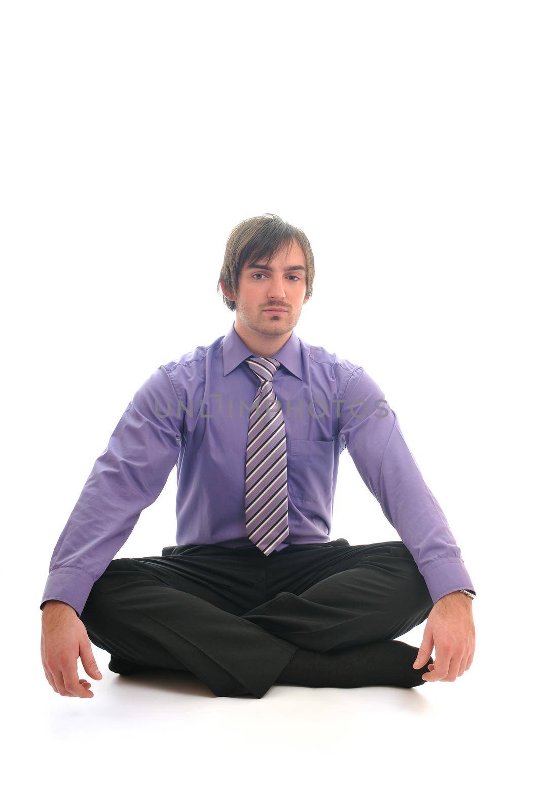 one yong business man relaxing yoga sit in lotus position