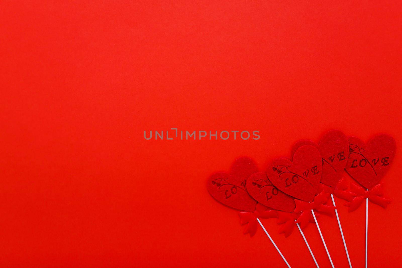 Red hearts on red background for valentines day. Holidays, love and romance.