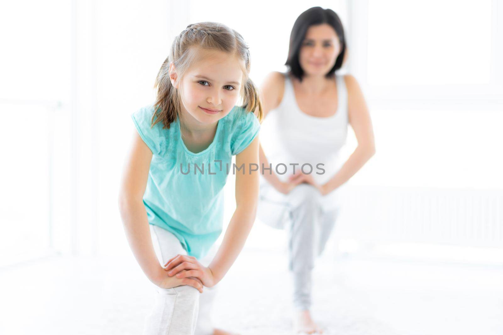 Cute little girl doing lunges by GekaSkr