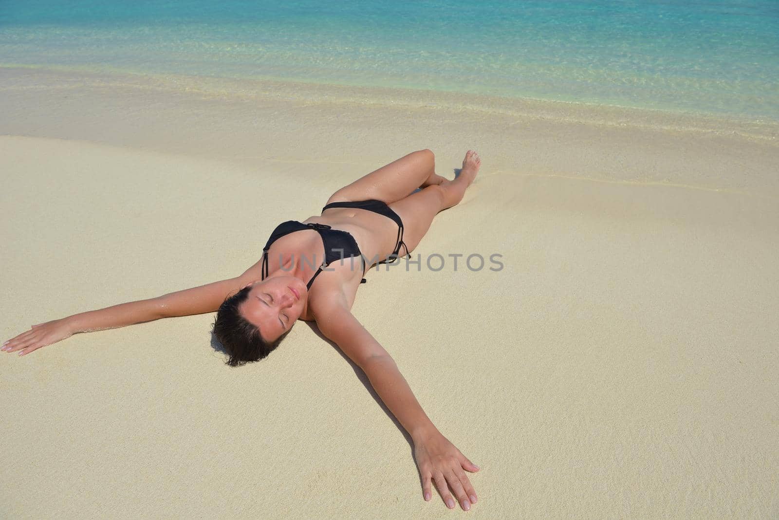 happy young woman on summer vacation on beautiful tropical beach have fun enjoy and relax