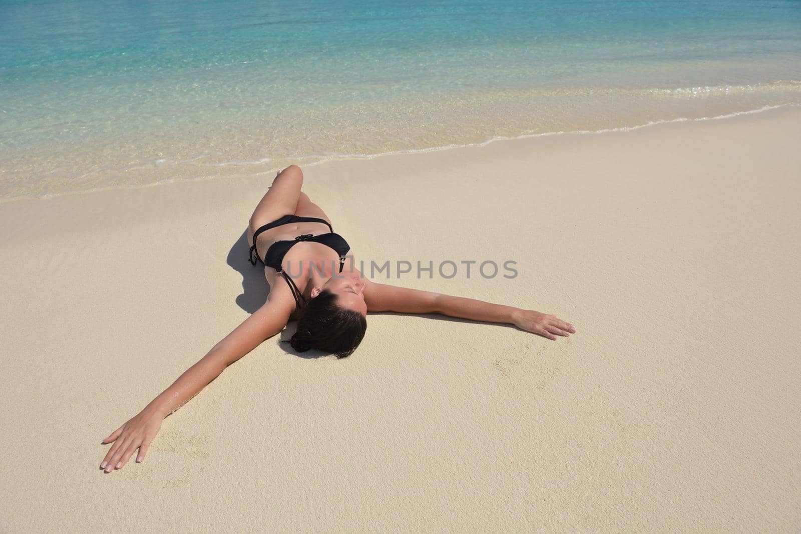 happy young woman on summer vacation on beautiful tropical beach have fun enjoy and relax