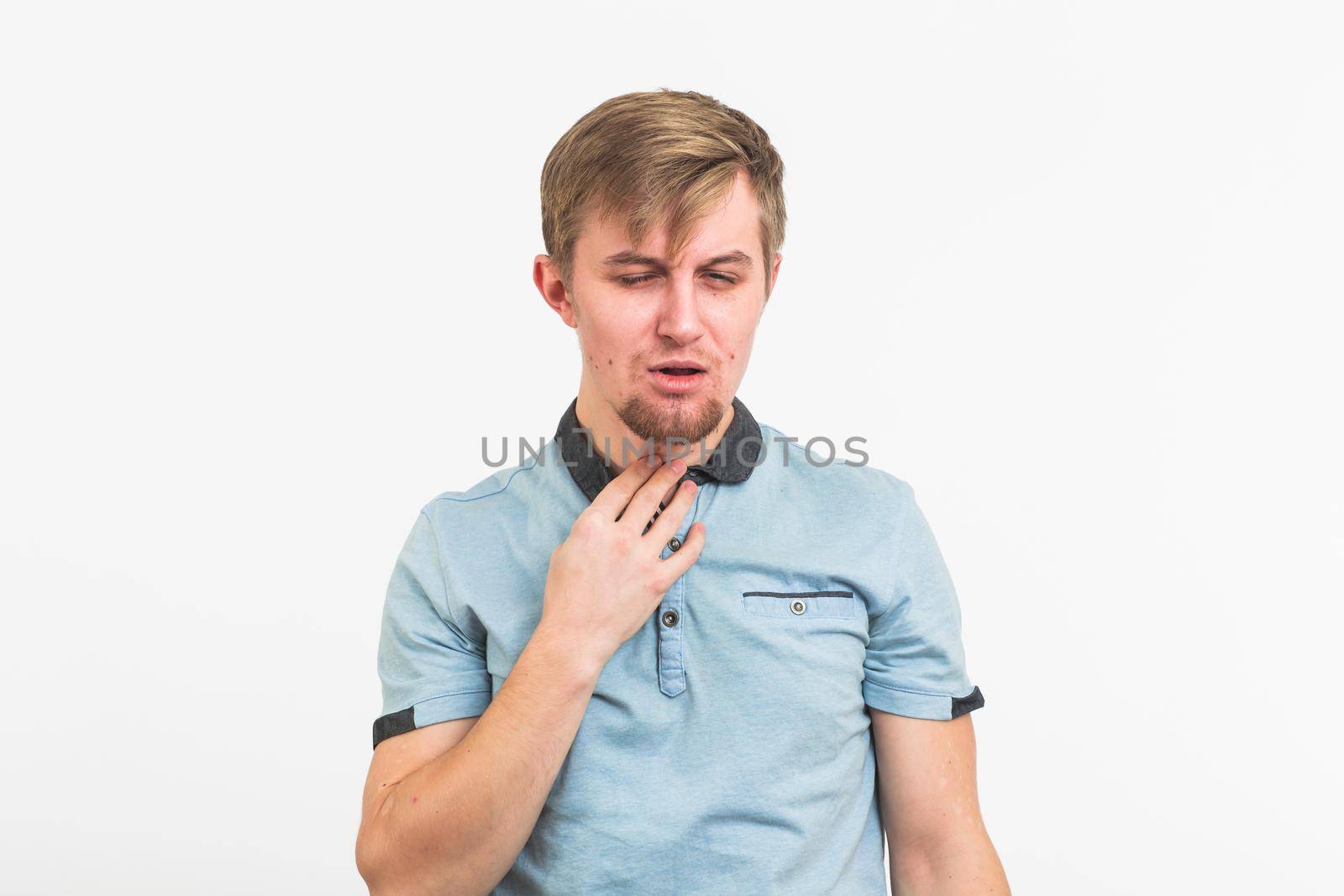 Sore throat. Men touching the neck on white background by Satura86