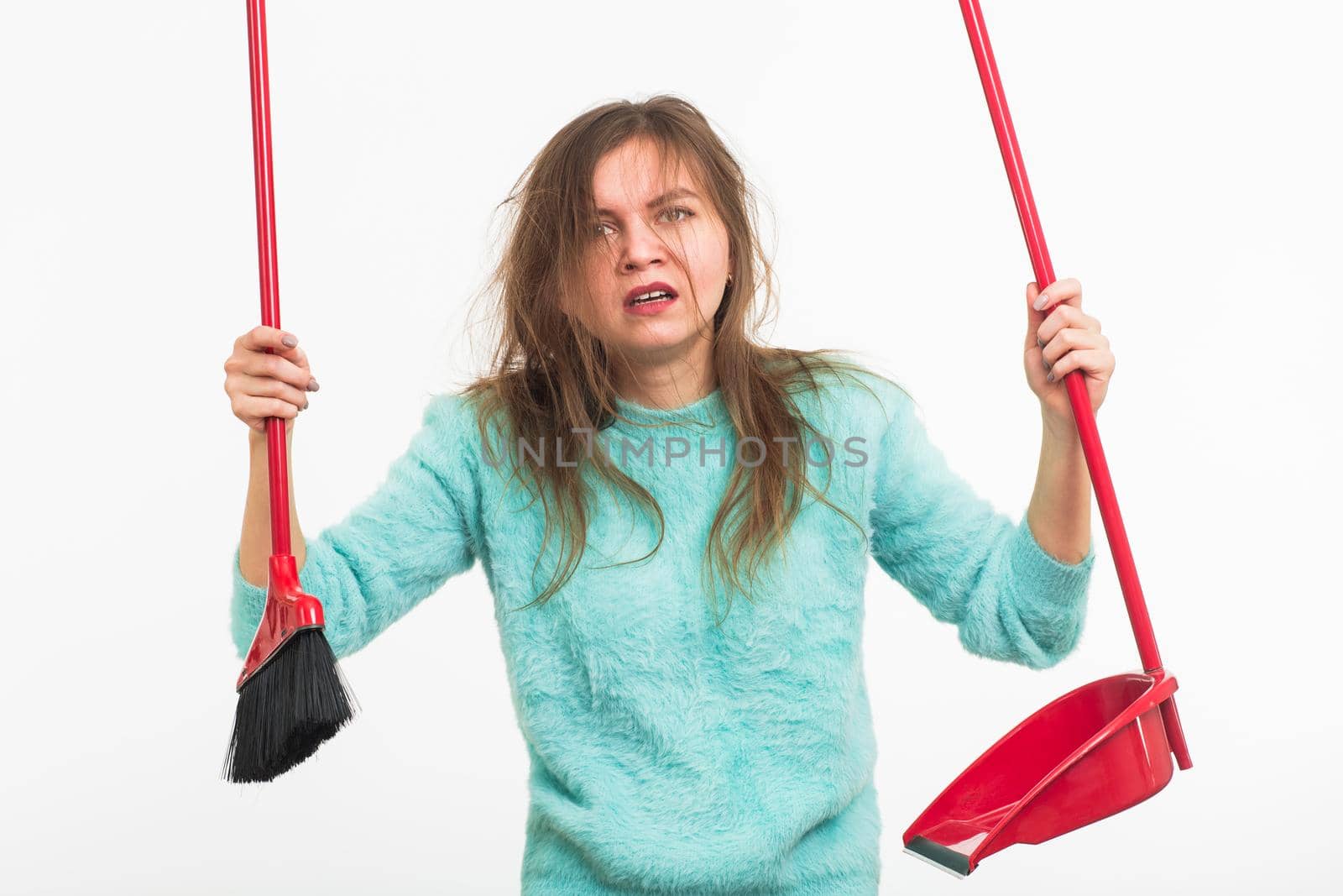Woman or housewife holding broom, tired to cleaning, on white background, isolated with copy space