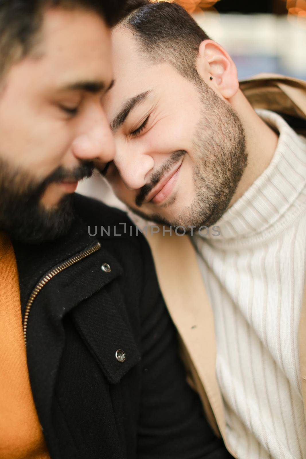 Portrait of two hugging happy caucasian gays. Concept of relationship and same sex couple.