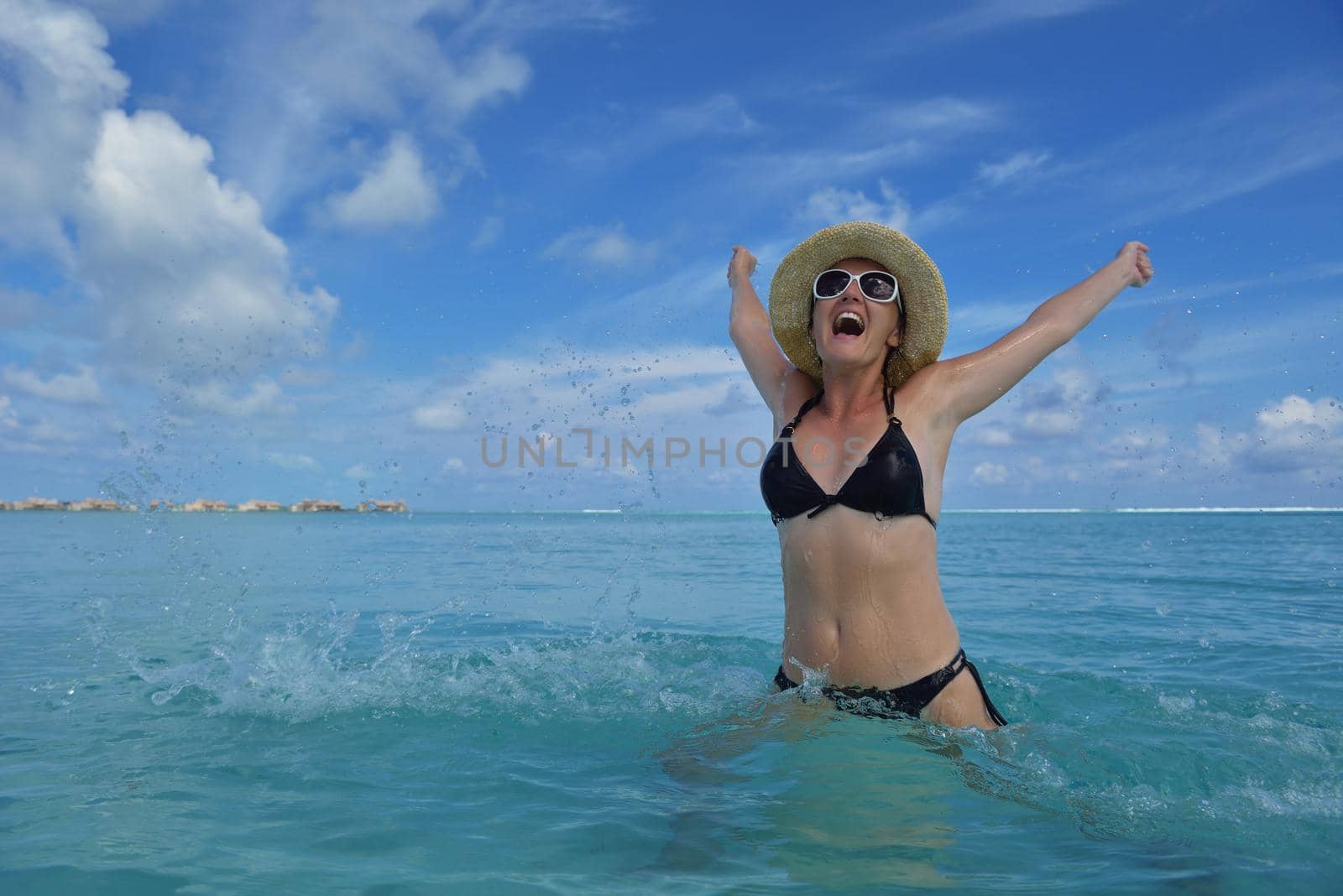 happy young woman on summer vacation on beautiful tropical beach have fun and relax