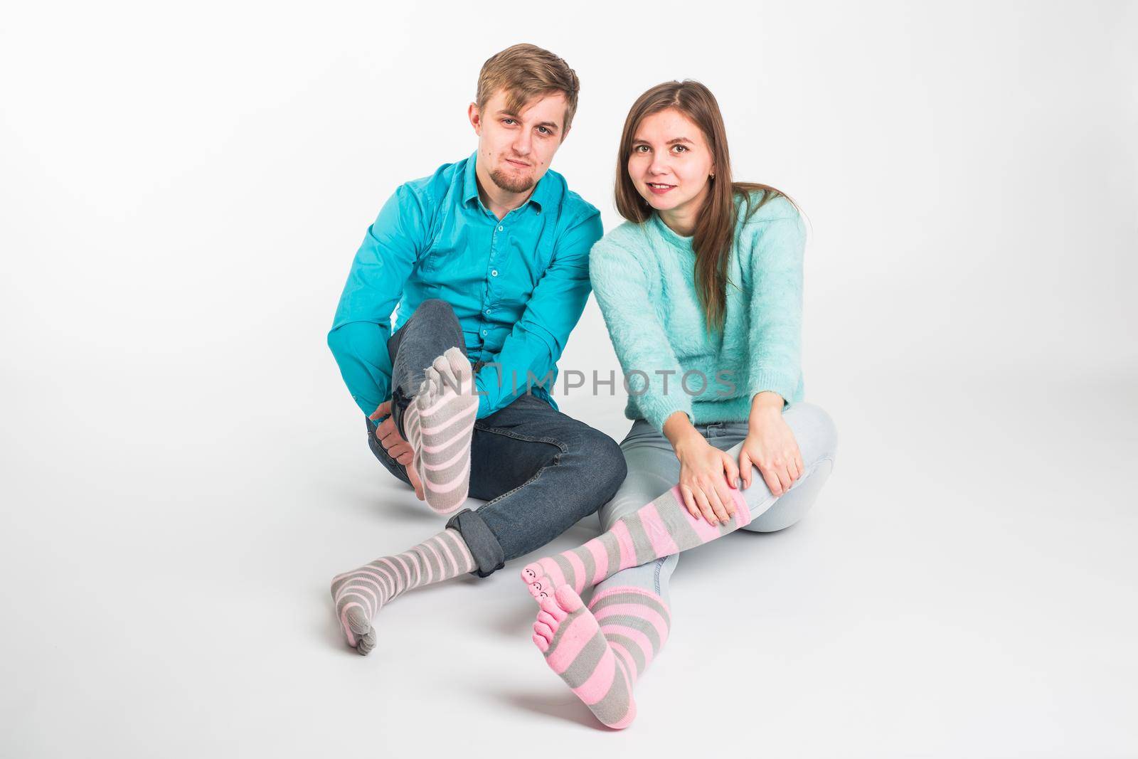 Portrait funny moments of excited couple fooling around to camera on white background. Having fun, weekends and valentines day concept by Satura86