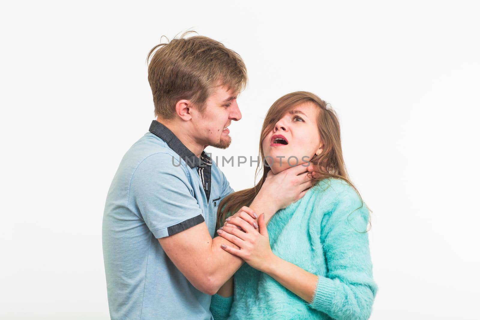 domestic violence, abuse and people concept - man beating woman on white background by Satura86