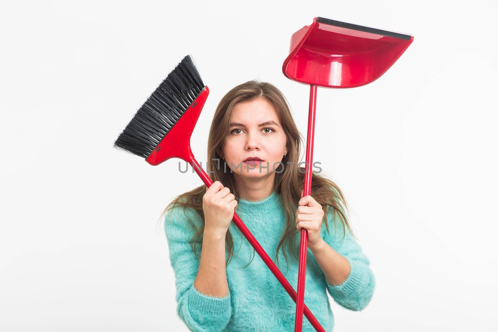 Woman or housewife holding broom, tired to cleaning, on white background, isolated with copy space