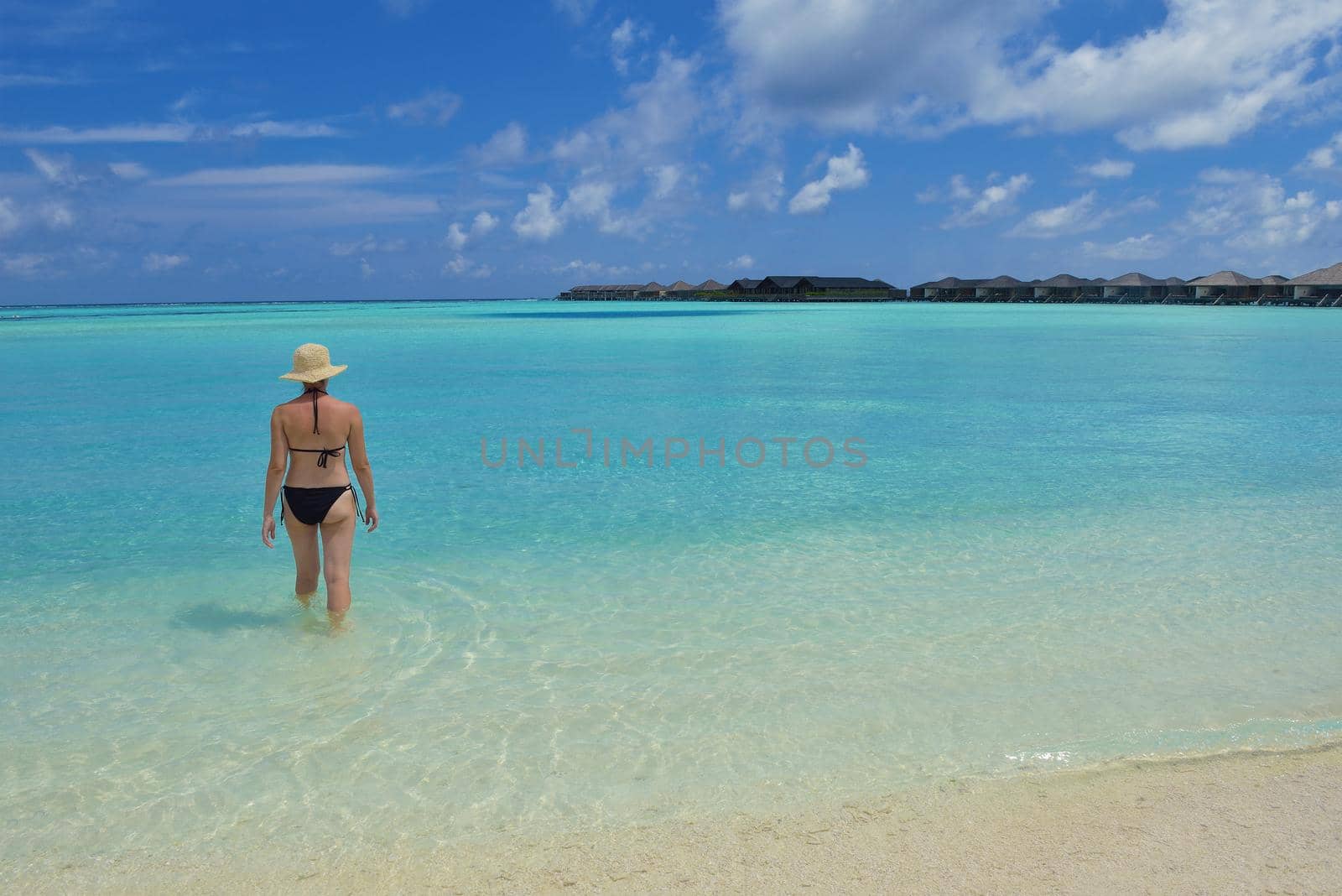 happy young woman on summer vacation on beautiful tropical beach have fun enjoy and relax