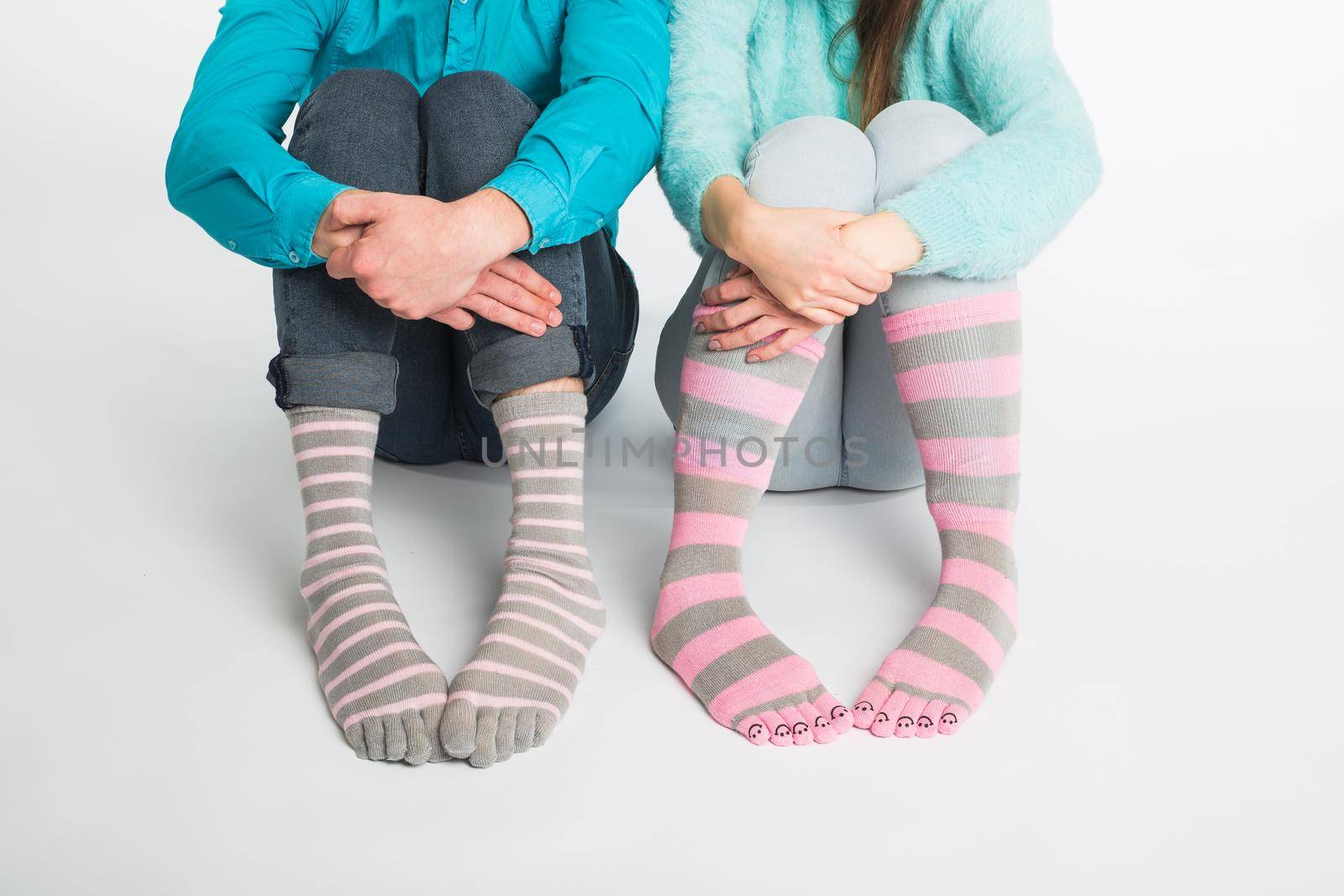 Valentine's day concept - Male and female legs in socks. by Satura86