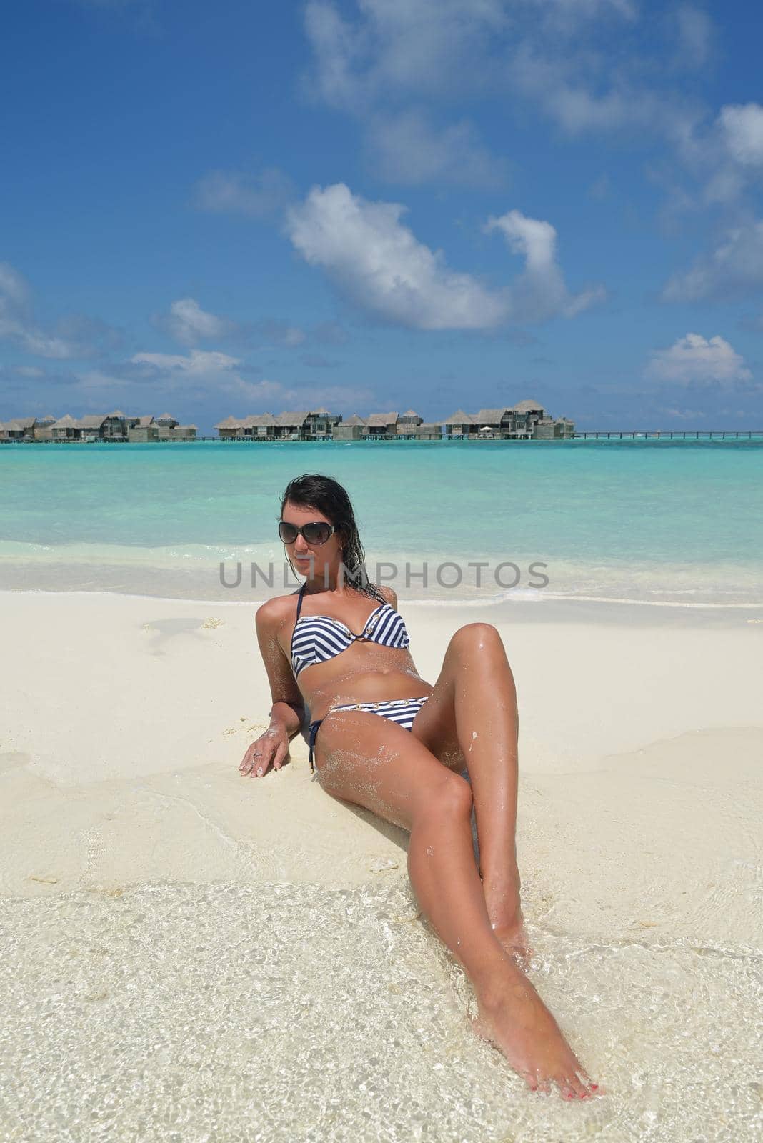 beautiful young woman  on beach have fun and relax by dotshock
