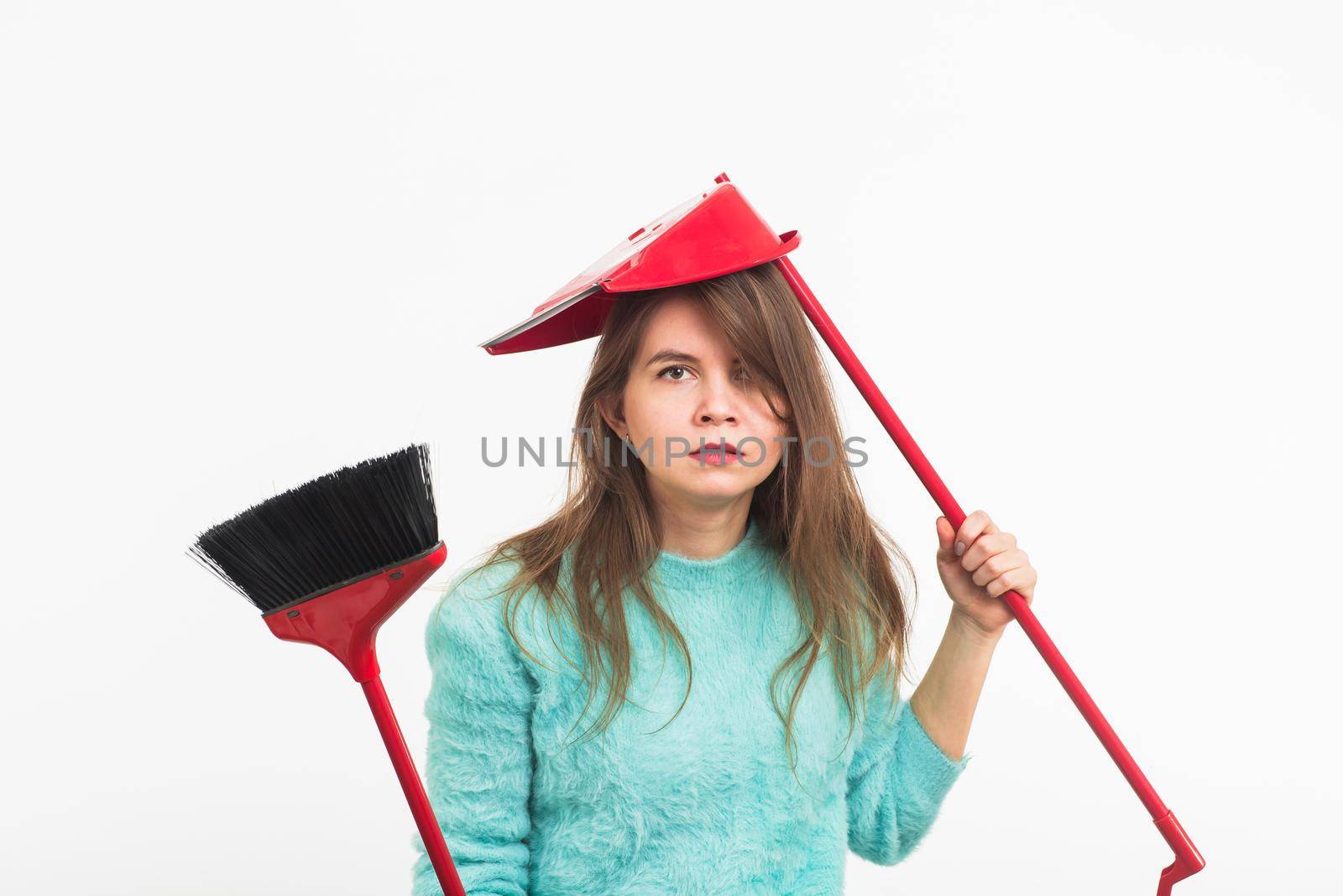 Woman or housewife holding broom, tired to cleaning, on white background, isolated with copy space. by Satura86