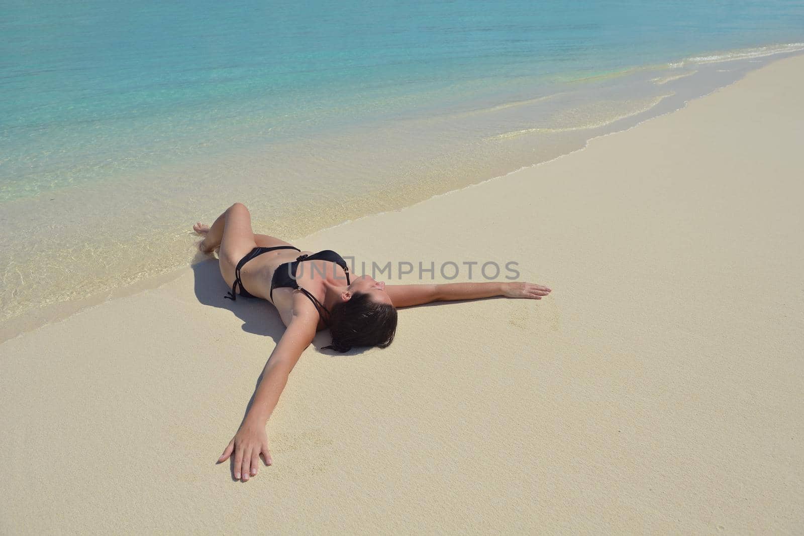 happy young woman on summer vacation on beautiful tropical beach have fun enjoy and relax