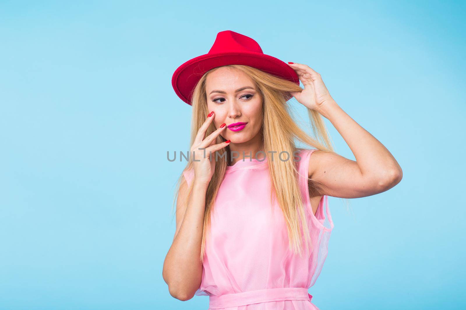 Young woman fashion lookbook model studio portrait on blue background. by Satura86