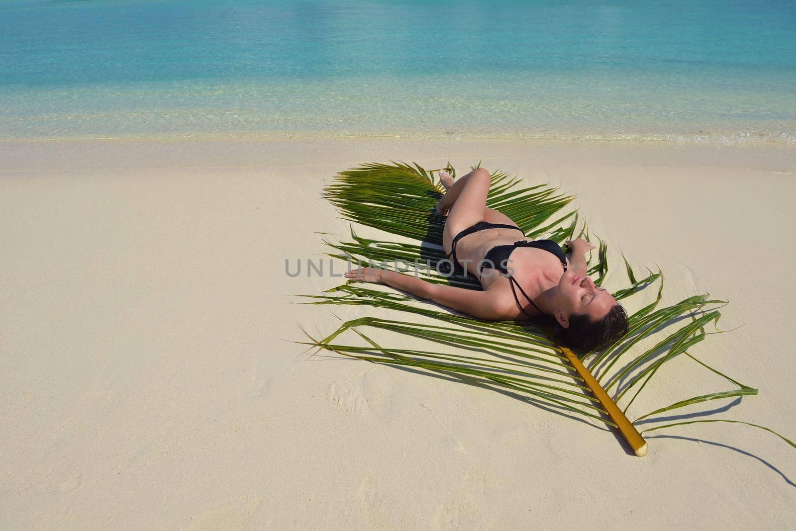 happy young woman on summer vacation on beautiful tropical beach have fun enjoy and relax