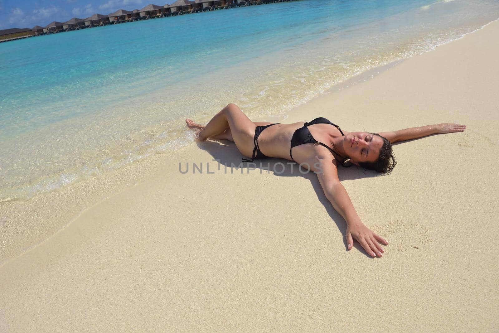 happy young woman on summer vacation on beautiful tropical beach have fun and relax